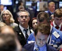 Wall Street mostly dips, but off lows with help from HP
