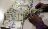 Indian rupee falls below 55 level against US dollar, down by 12 paise