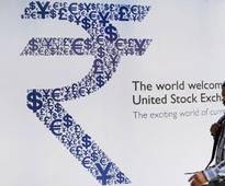 Rupee dances to Bernanke tune, hits new low of 59.9