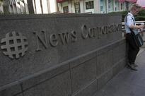 News Corp to take charge of up to $1.4 billion this quarter